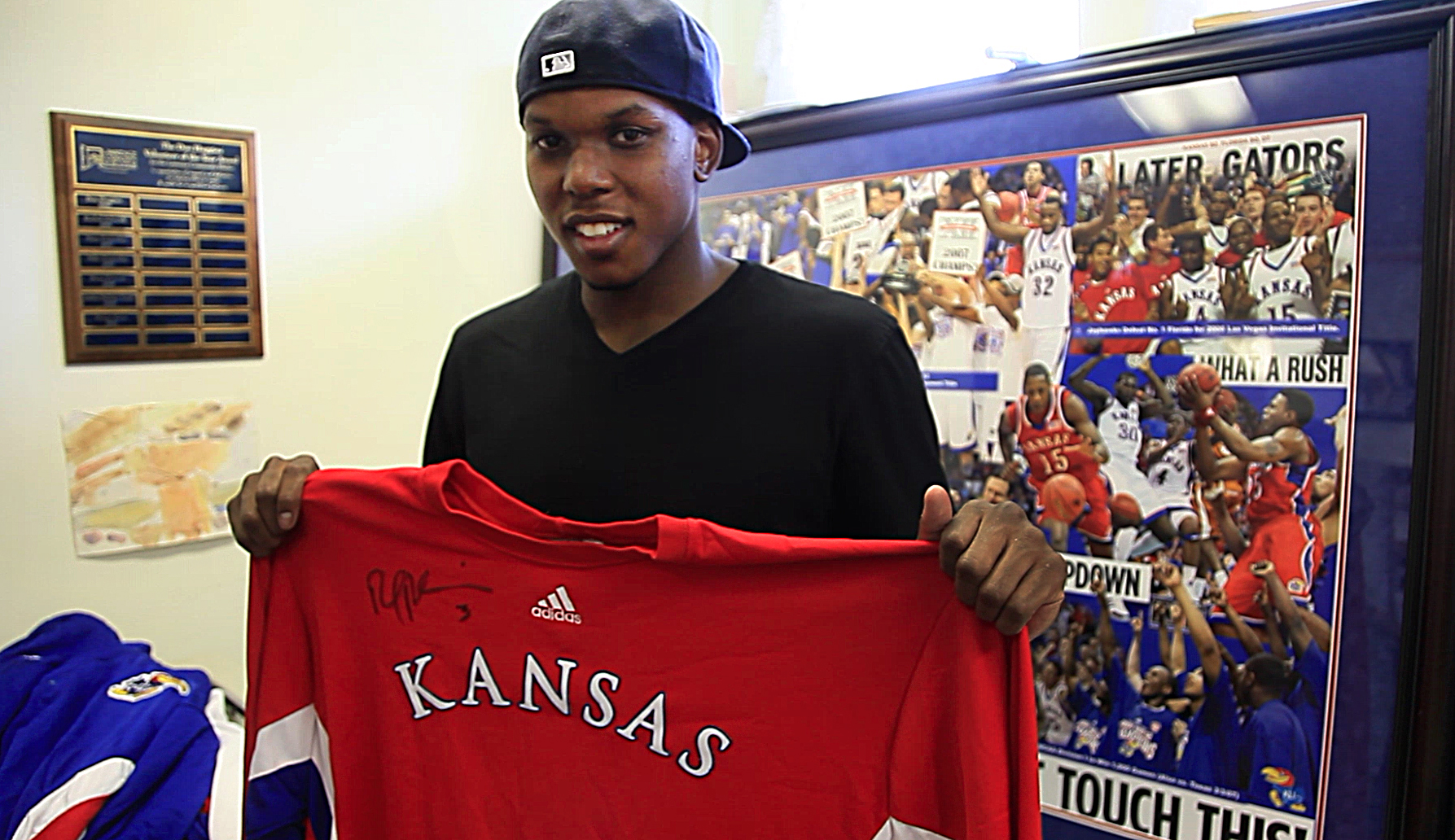 Russell Robinson makes rounds of Lawrence charities to donate old gear